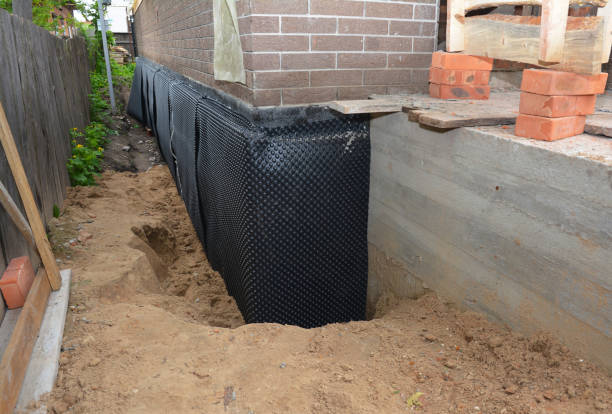 Happy homeowners after waterproofing job in Millbrook